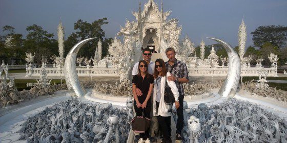 Luca Lucarelli and Mantana Patanompee from Fantasia Wedding and Travel with happy clients at the White Temple (Wat Rong Khun) in Chiang Rai, Thailand. Expert local guides for bespoke tours.